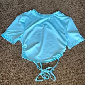 light blue, size S, silk shirt with a hole in the back